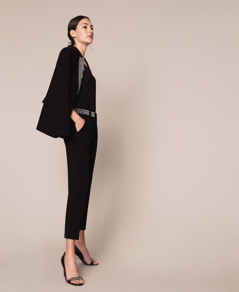 Pantaloni a sigaretta con borchie