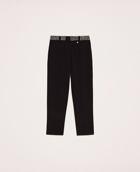 Pantaloni a sigaretta con borchie