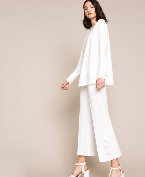 Pantaloni con volant e perle