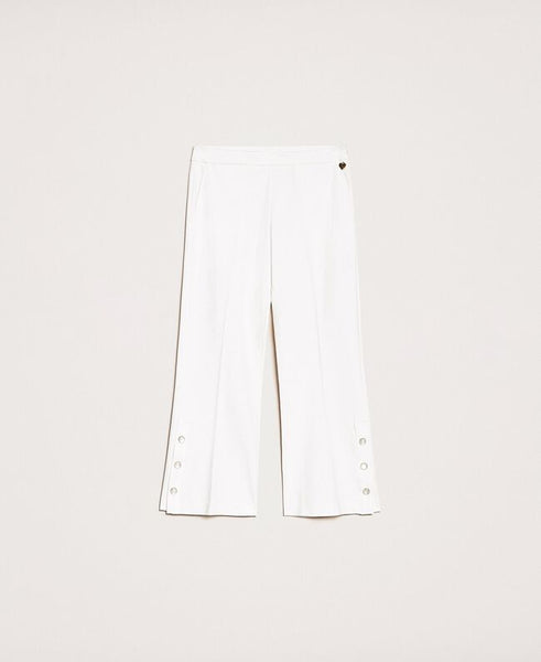 Pantaloni con volant e perle