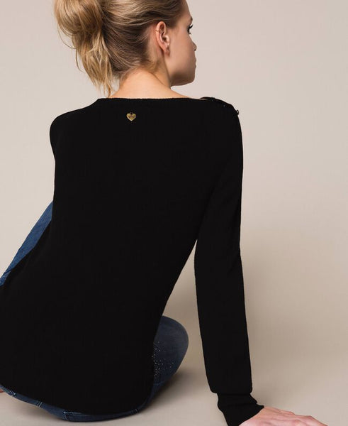 Maglia con bottoni strass sulle spalle