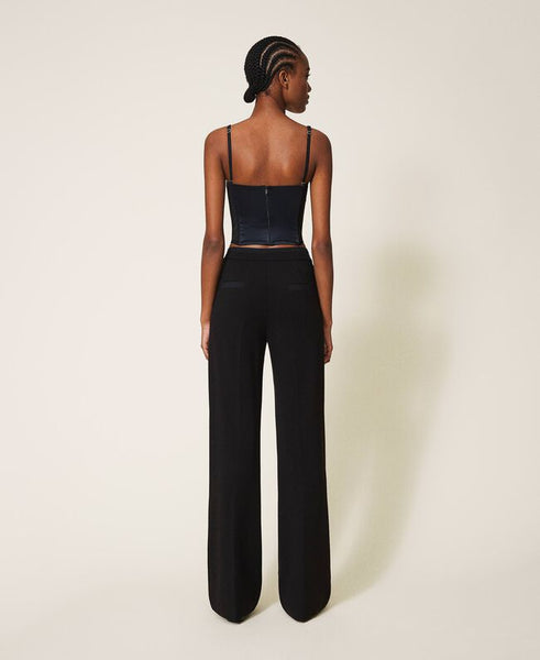 Pantaloni con dettagli in crêpe de Chine