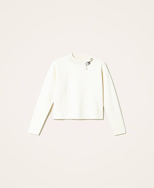 Maglia boxy con spilla gioiello