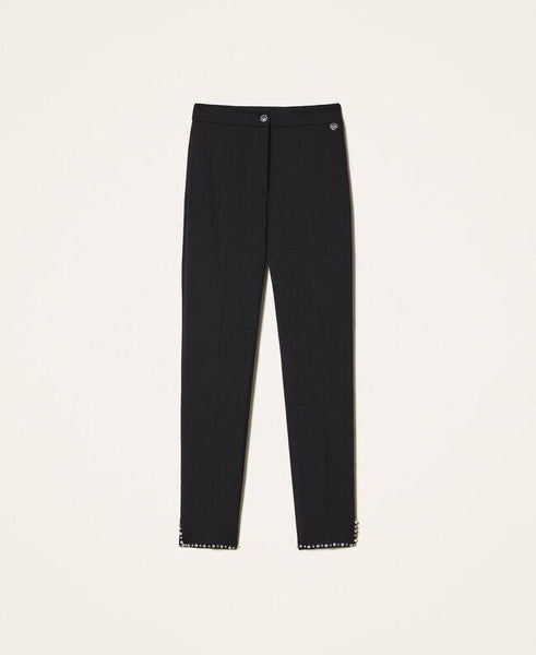 Pantaloni a sigaretta con borchie