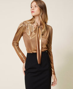 Blusa laminata con fusciacca