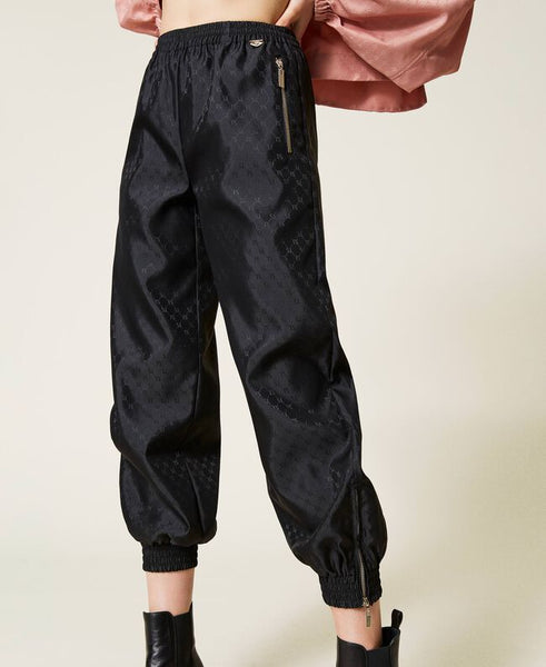 Joggers con logo allover