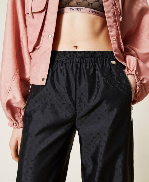 Joggers con logo allover