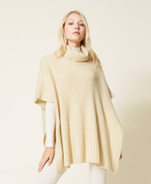 Poncho in maglia con paillettes