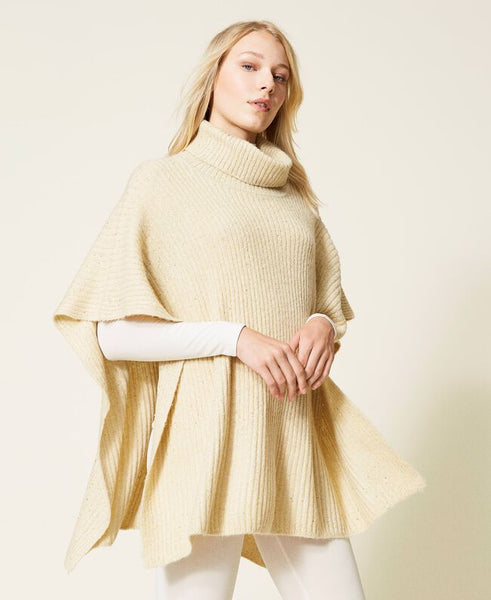 Poncho in maglia con paillettes