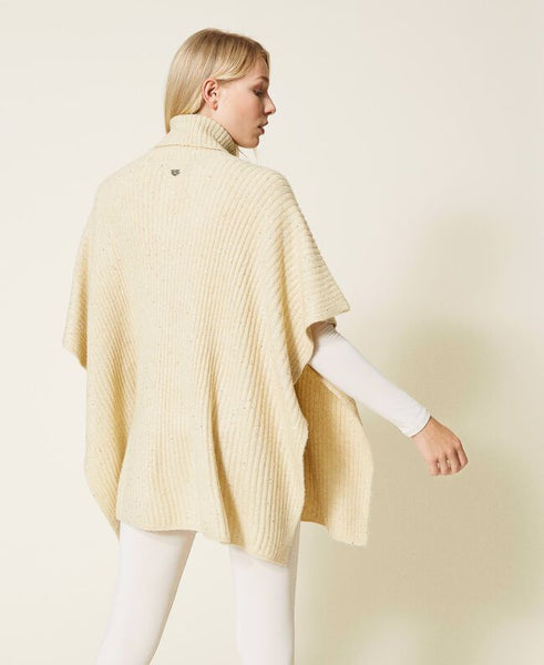 Poncho in maglia con paillettes