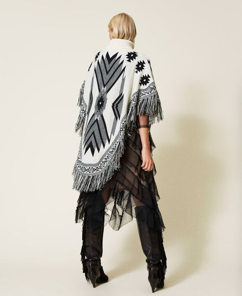 Poncho jacquard con frange
