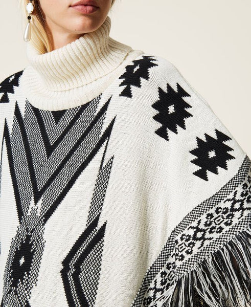 Poncho jacquard con frange