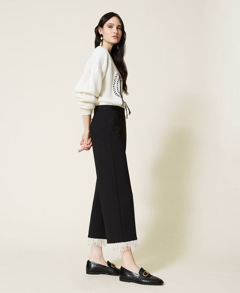 Pantaloni cropped con frange