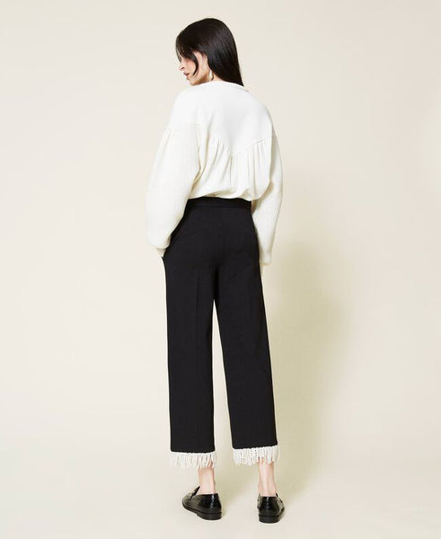 Pantaloni cropped con frange
