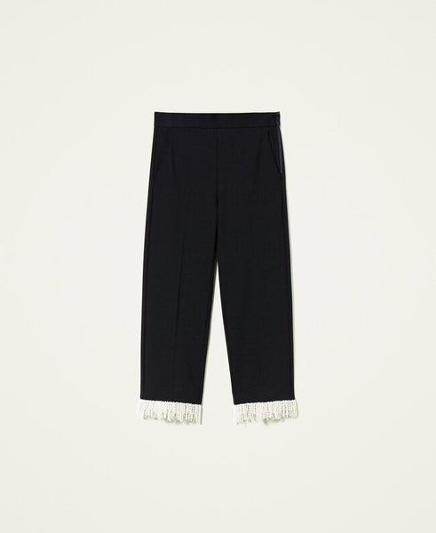 Pantaloni cropped con frange