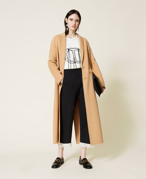 Pantaloni cropped con frange